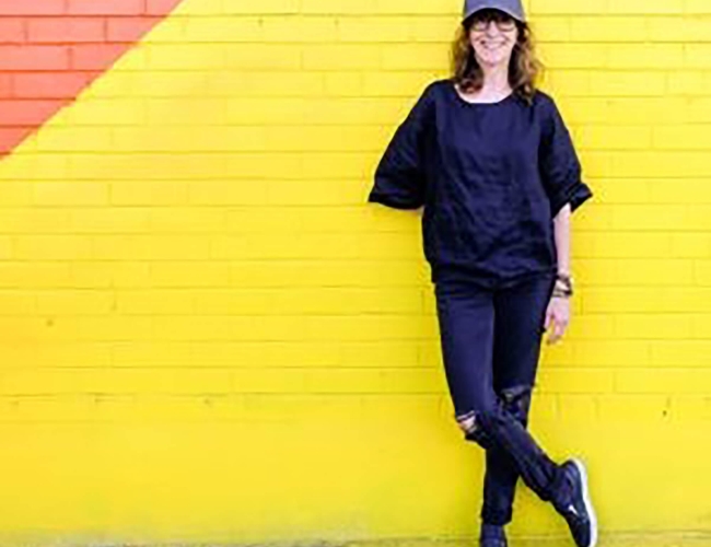 woman standing in front of wall