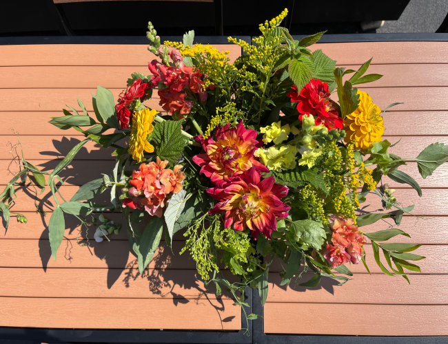 Red flower arrangement made at the Black Fox Flower Class