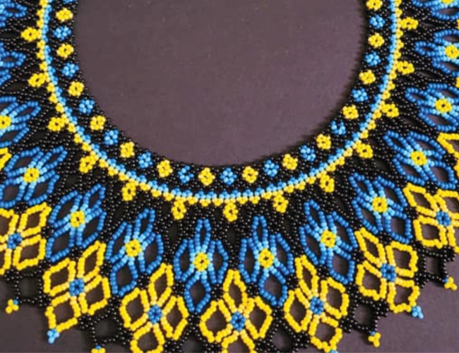 picture of a blue, yellow, and black Ukrainian beaded necklace (sylyanka)