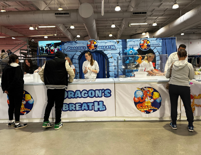 People standing in front of the vendor Dragon's Breath