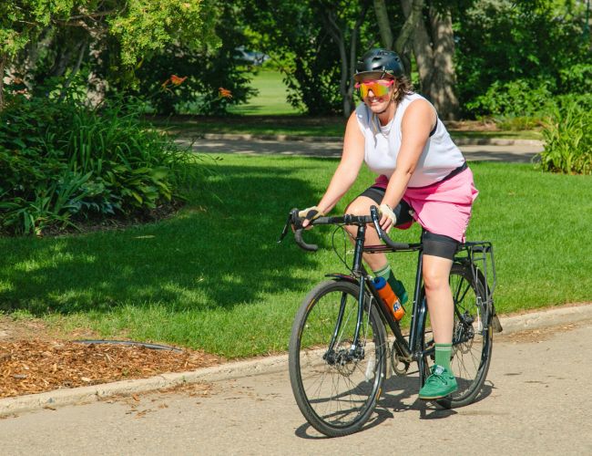 Person riding a bicycle on a trail in Saskatoon