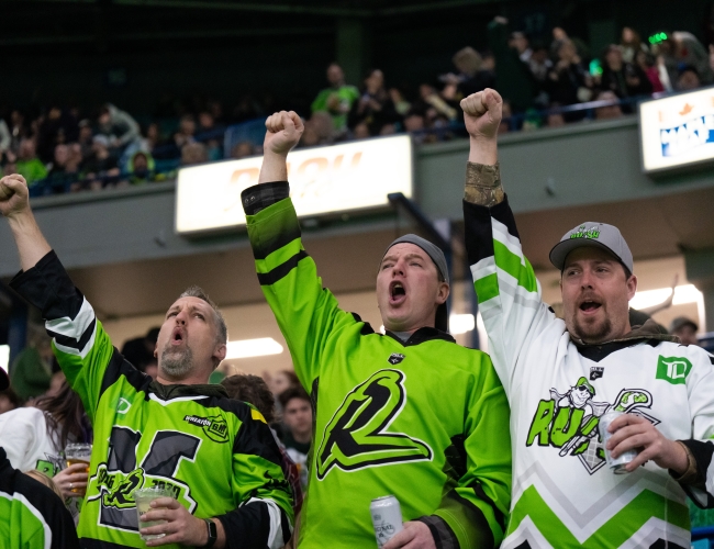 Three Rush Fans Cheering in the Stands