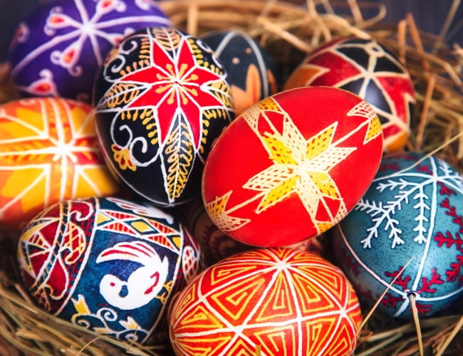 A basket of brightly coloured Ukrainian Easter eggs.