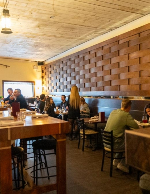 groups of people enjoying food at Primal restaurant