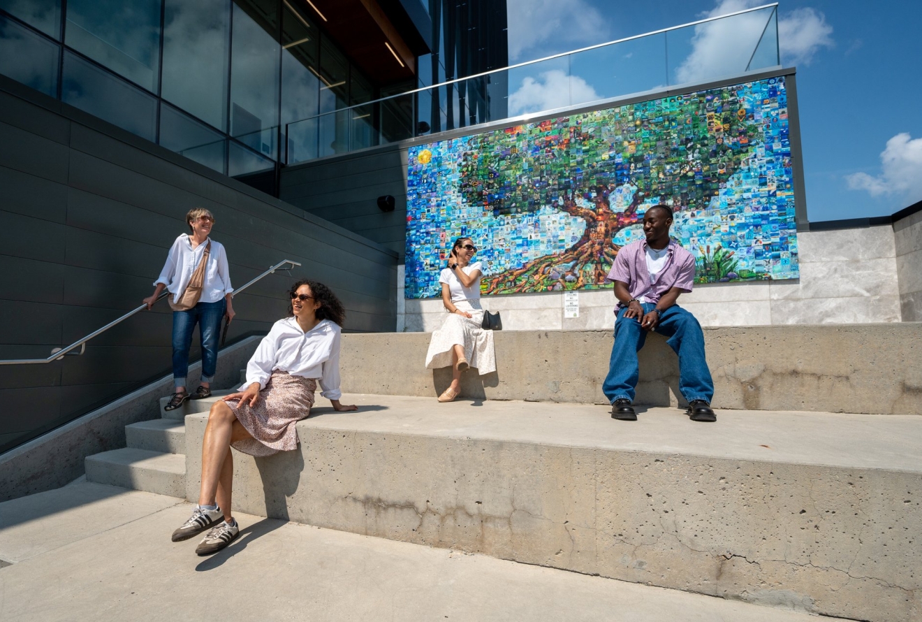 people looking at mural 