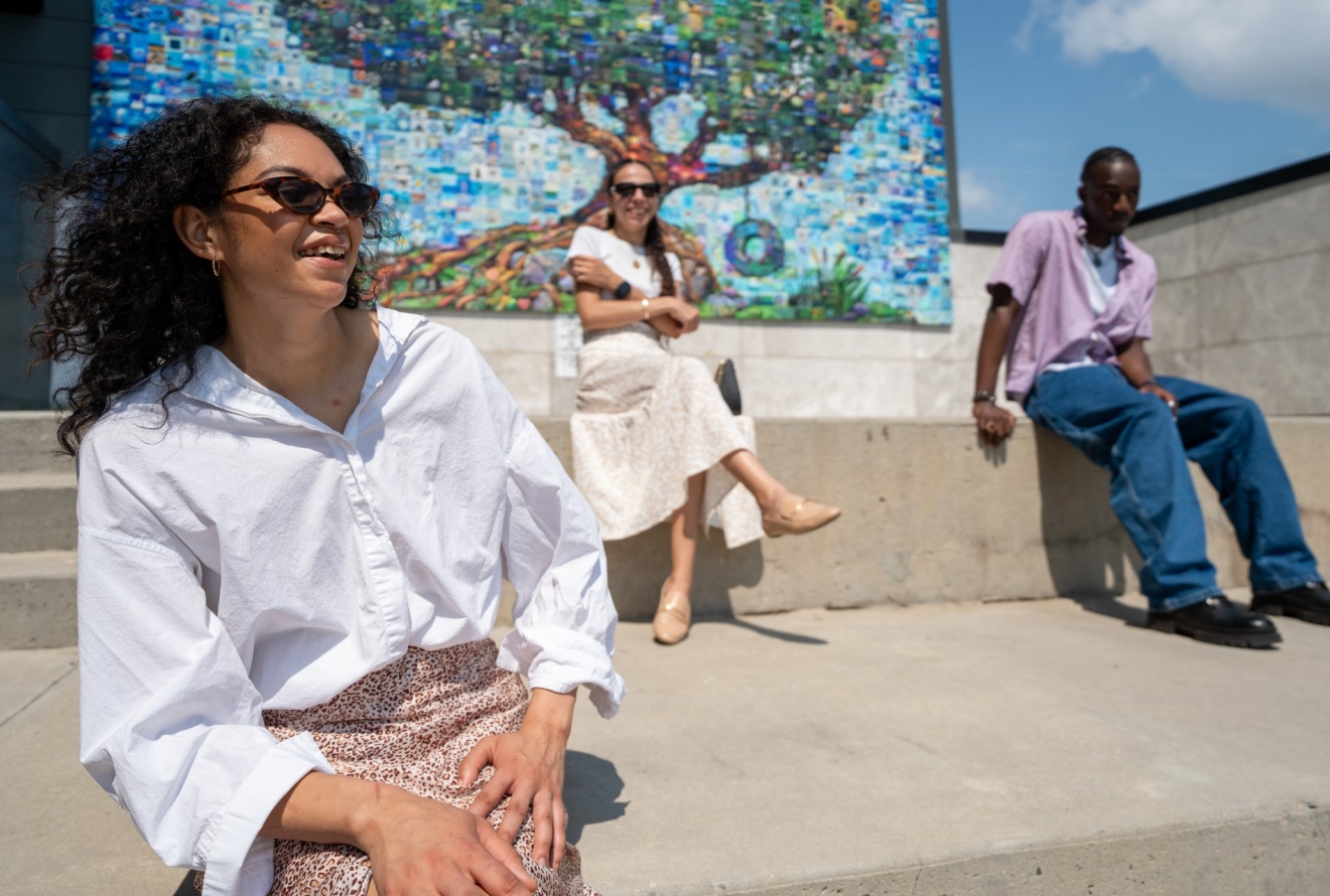 people looking at mural 